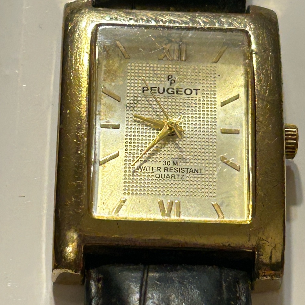 Peugeot Gold and Black Timepiece